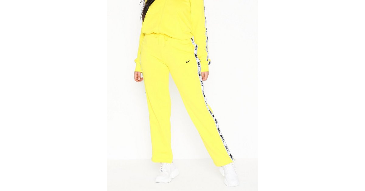 Buy Nike NSW Pant Logo Tape Popper Yellow Nelly