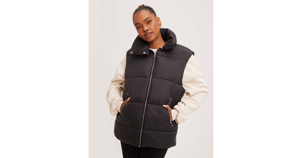 Black puffer vest outlet with fur hood