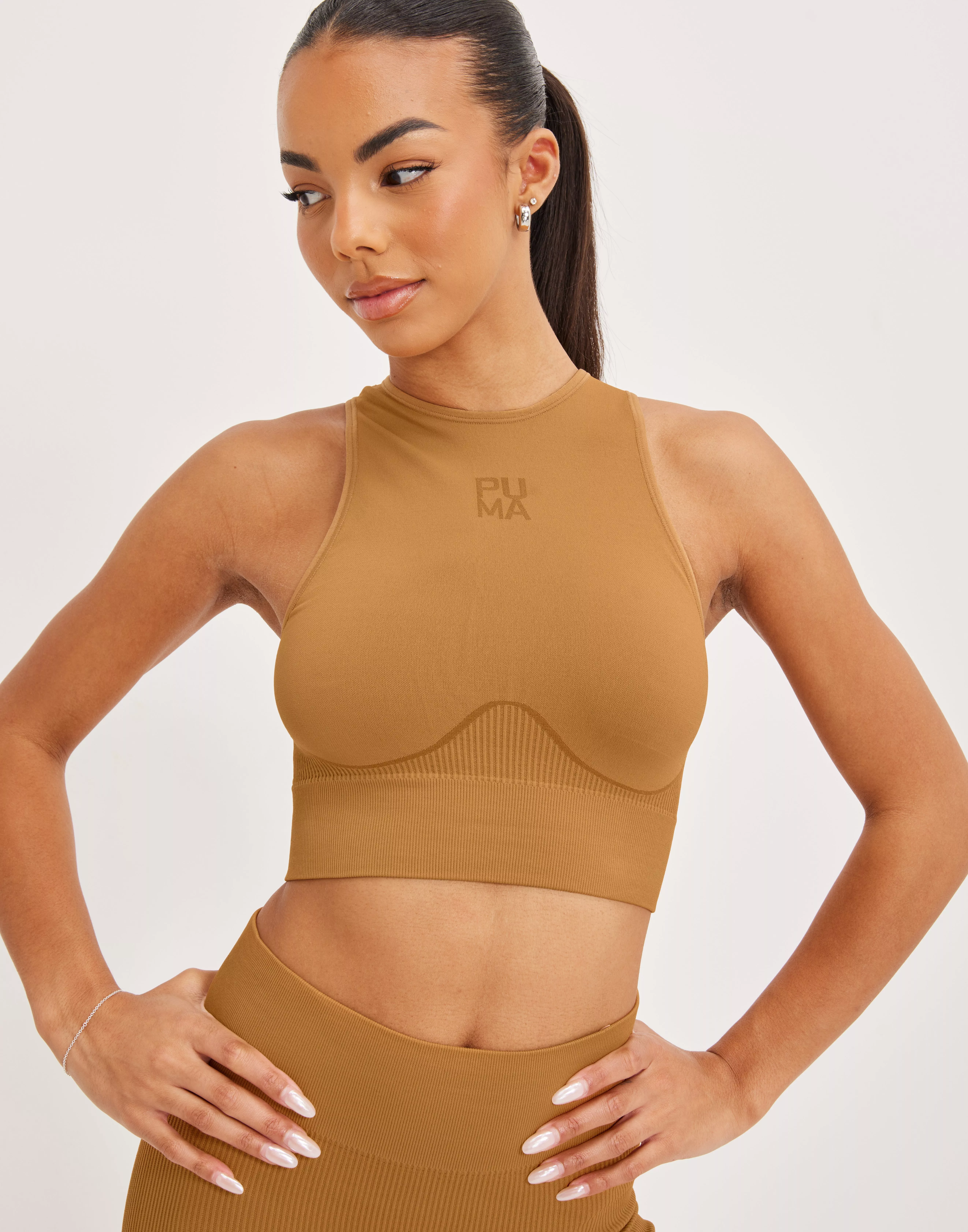 PUMA Training Evoknit Seamless Light Support Sports Bra in Brown