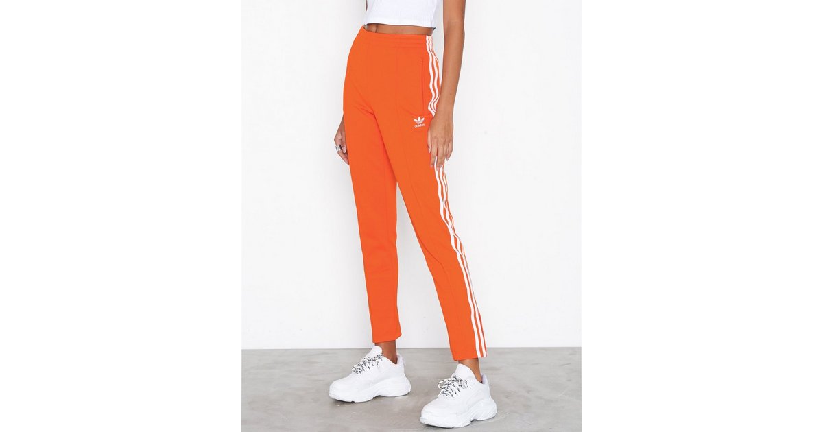 Orange track pants online adidas